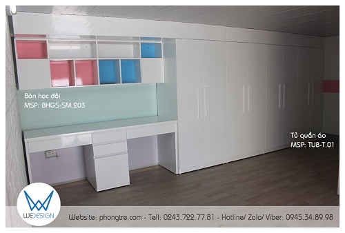 Mảng tường 5.2m bố trí tủ quần áo chiều ngang 3.2m và bàn học đôi chiều ngang 2m cao kịch trần, có trán che phần dầm trần